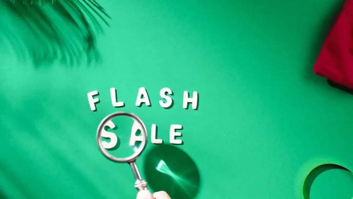 Scritta 'FLASH SALE' con lente di ingrandimento su sfondo verde.