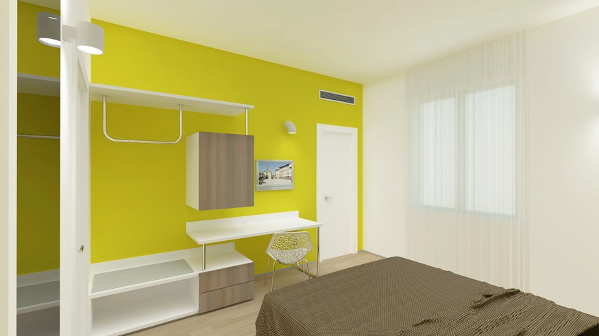  Camera da letto moderna con parete gialla e scrivania