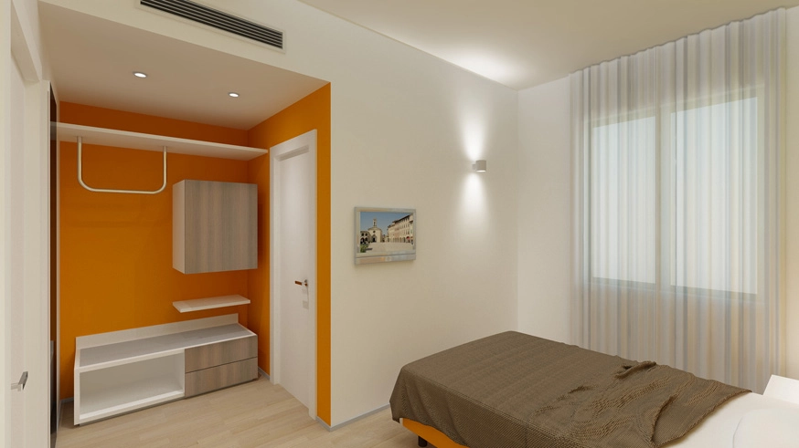 Camera da letto moderna con parete arancione e armadio