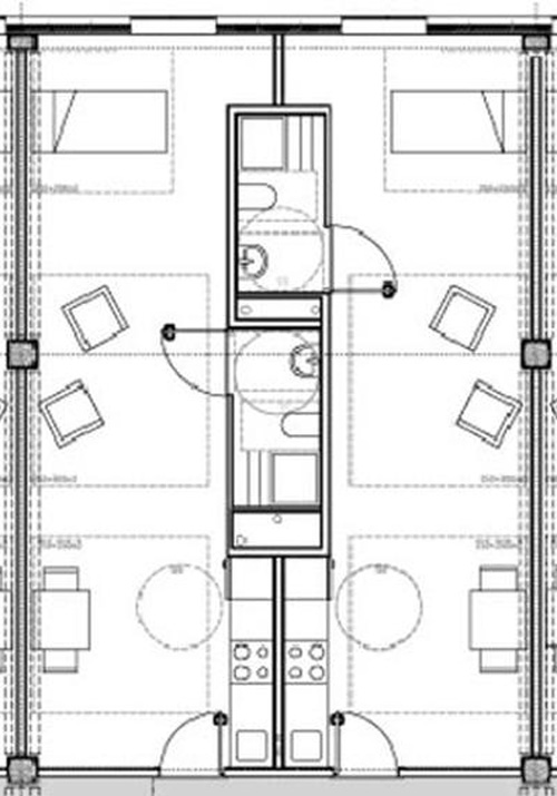 Piantina di camere d'hotel con layout simmetrico e arredi. ​