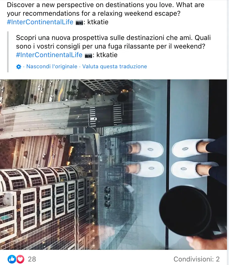 Post di InterContinental Hotels su Facebook con l'immagine di una persona che guarda giù da un grattacielo con la scritta #InterContinentalLife.
